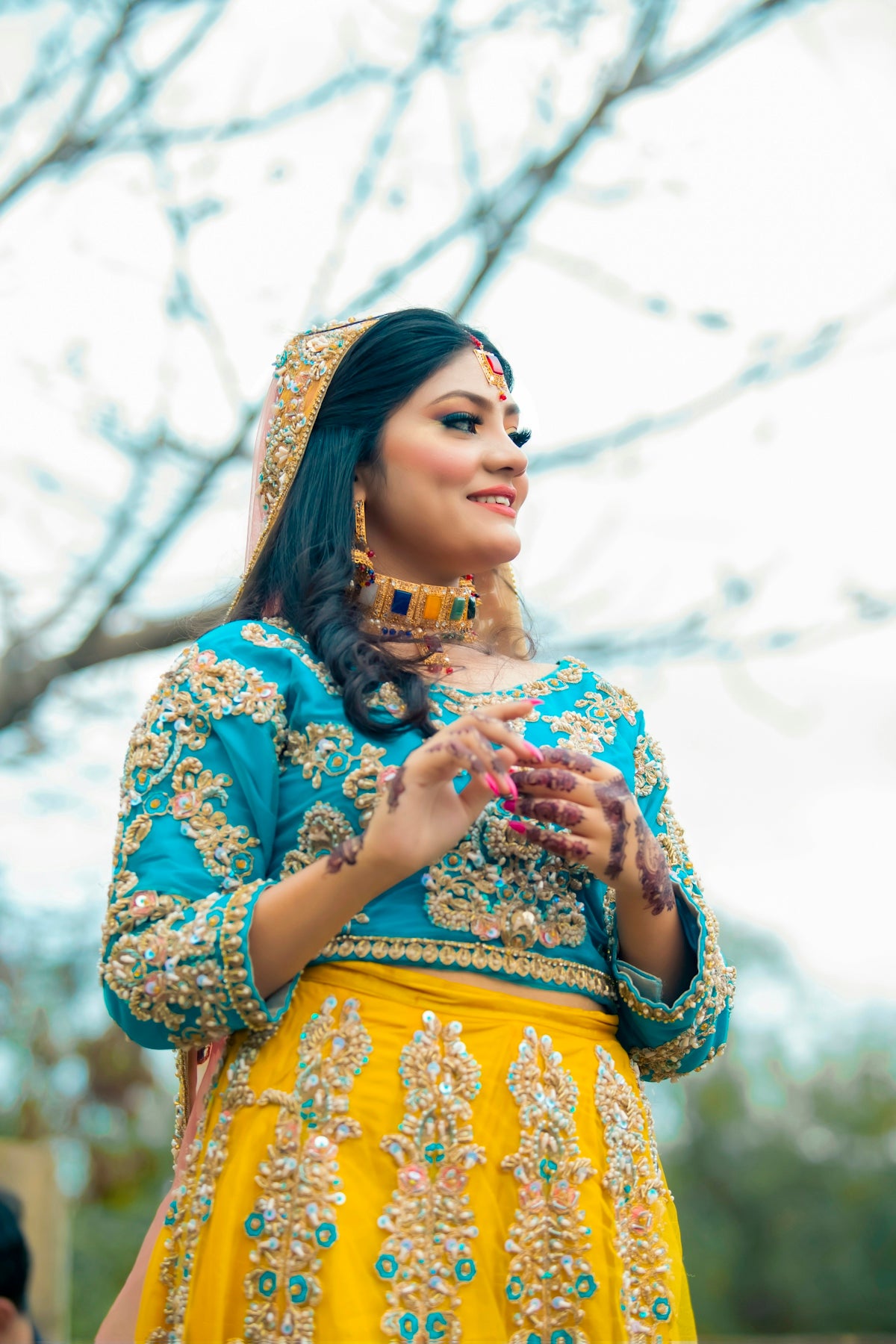 A woman in traditional indian attire smiles