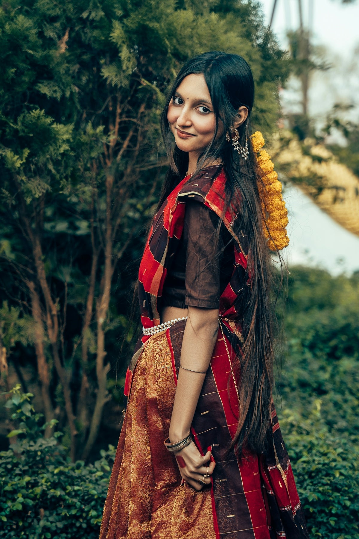 A woman in traditional indian attire smiles gently smiles