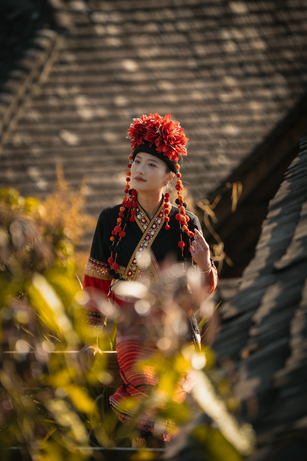 Young woman in traditional ethnic attire and headdress.